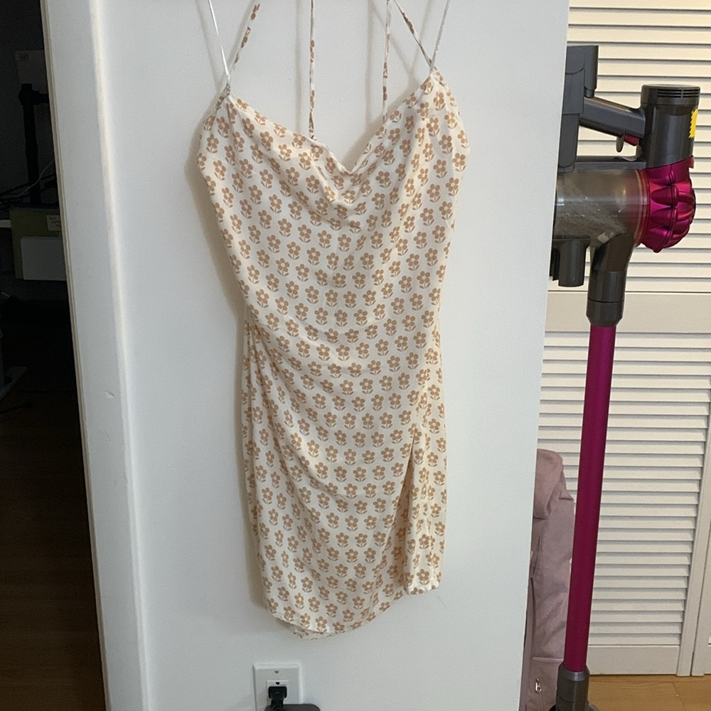 Size large O’Neill open back light strappy dress. Off-white and tan floral.